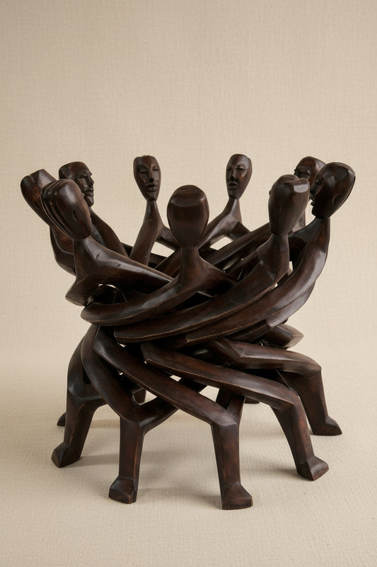 Wooden sculpture of interlocking figures on a beige background