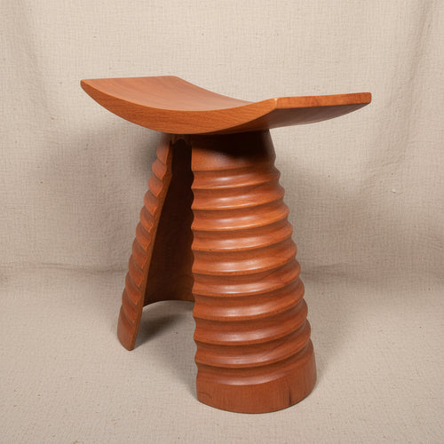 Wooden stool with a unique design on a white background
