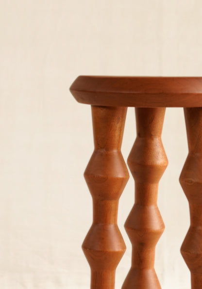 Wooden baluster on a beige background